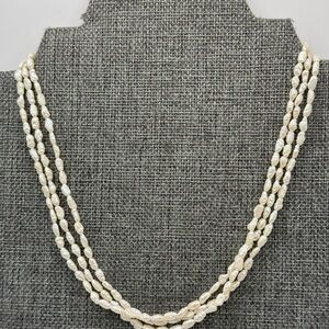 Vintage 3 strands Rice Pearls 14/20gf clasp.